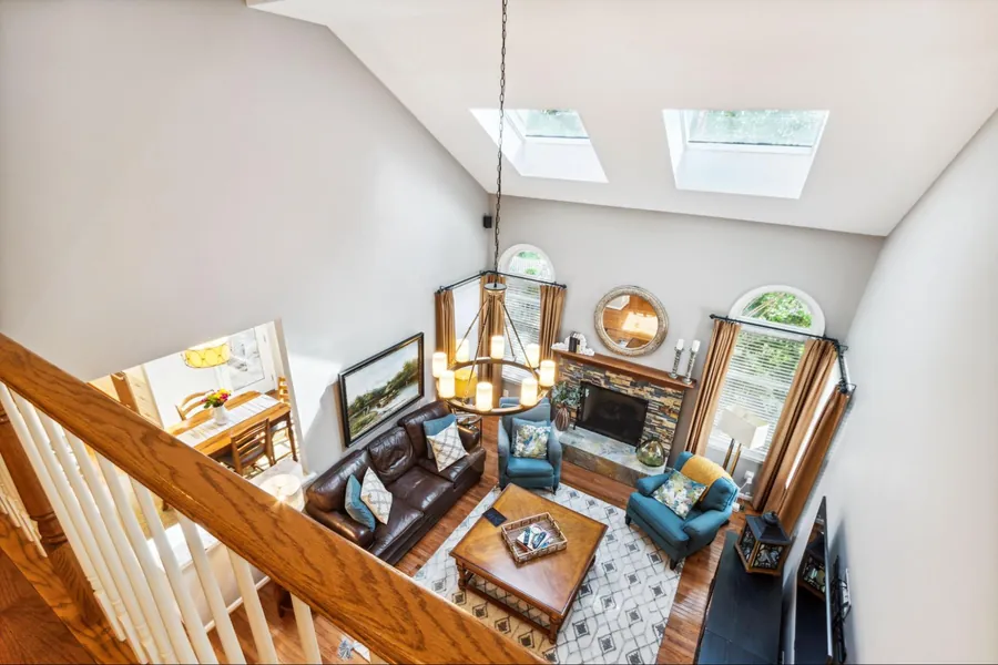 Sold home — living room from above with cathedral ceiling and skylights