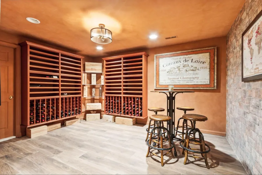 Sold home — custom wine cellar with wood racks and bistro seating